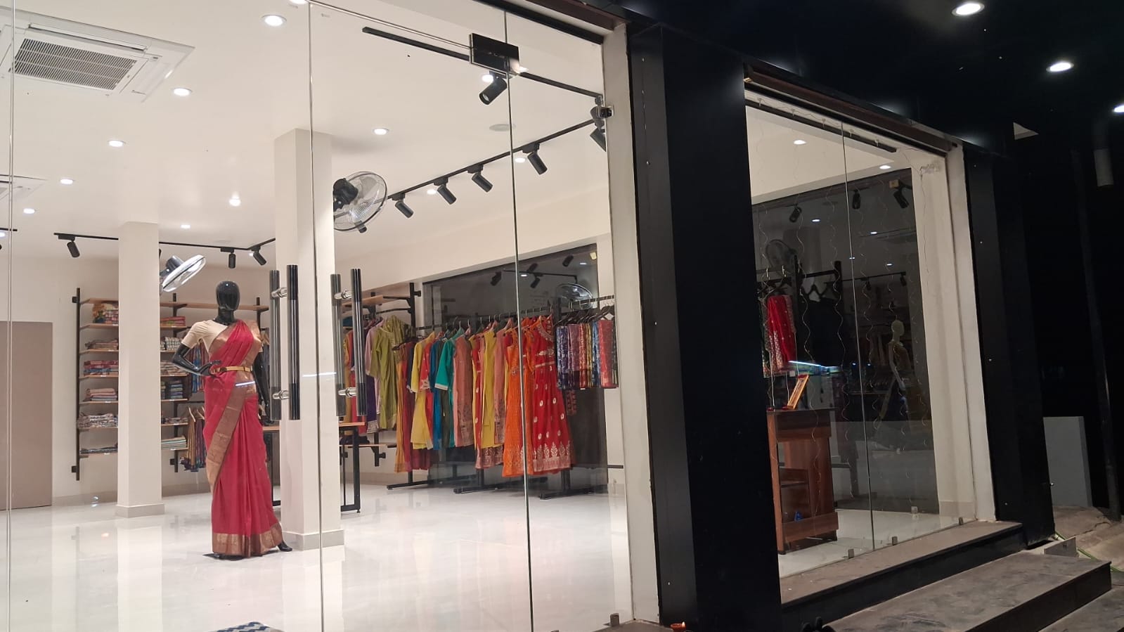 Mannequin display with sarees at d'Trenz store front