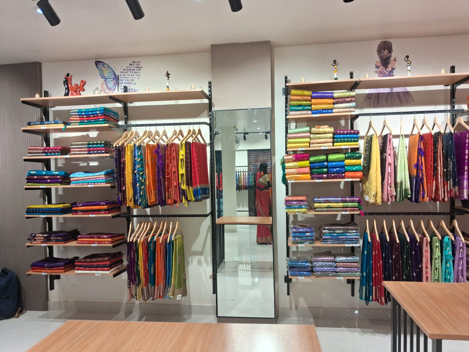Shelves with multicolor stacked sarees